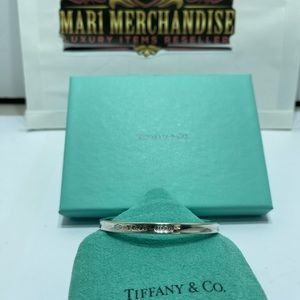 Tiffany and Co. open Bangle silver.